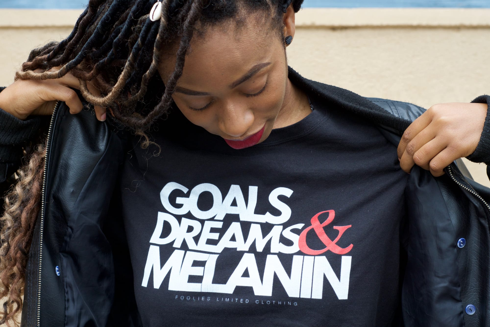 lack woman with lots wearing tee shirt goals, dreams, melanin