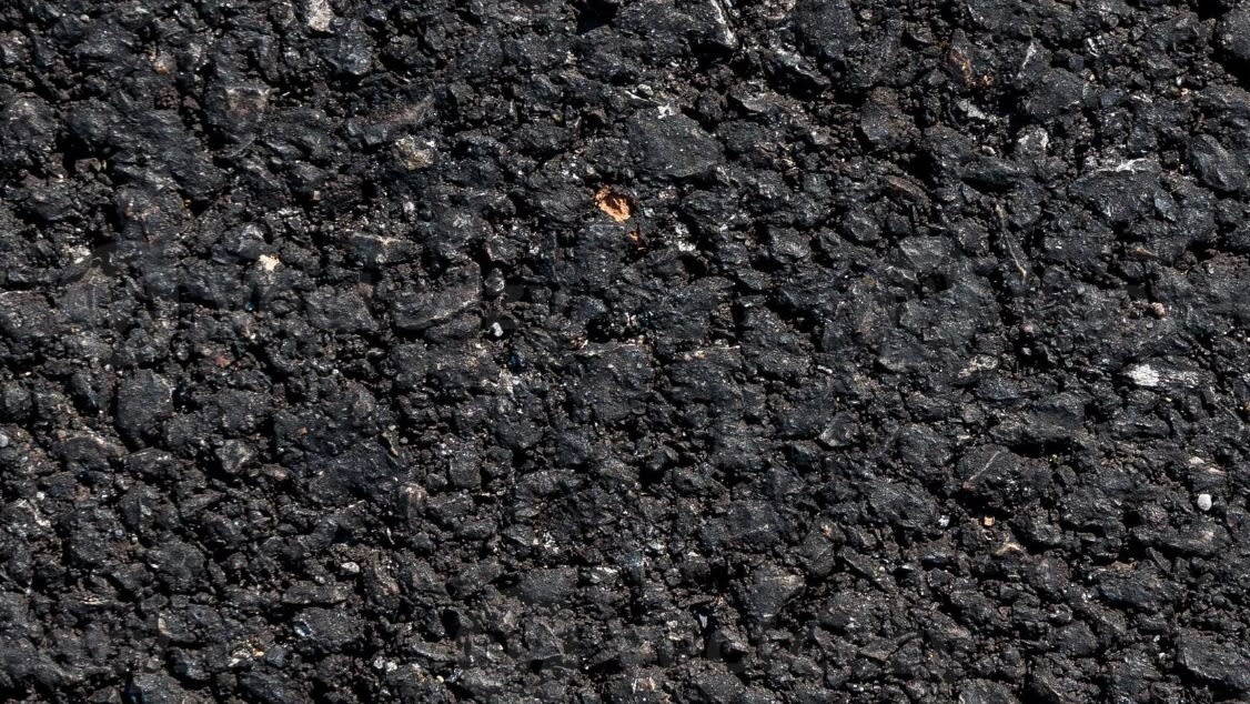 close-up-of-asphalt-road-black-nature-asphalt-background-background-texture-of-rough-asphalt-macadamized-texture-photo