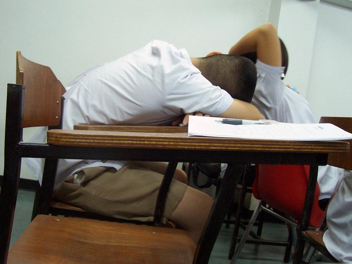 Tired boy in school