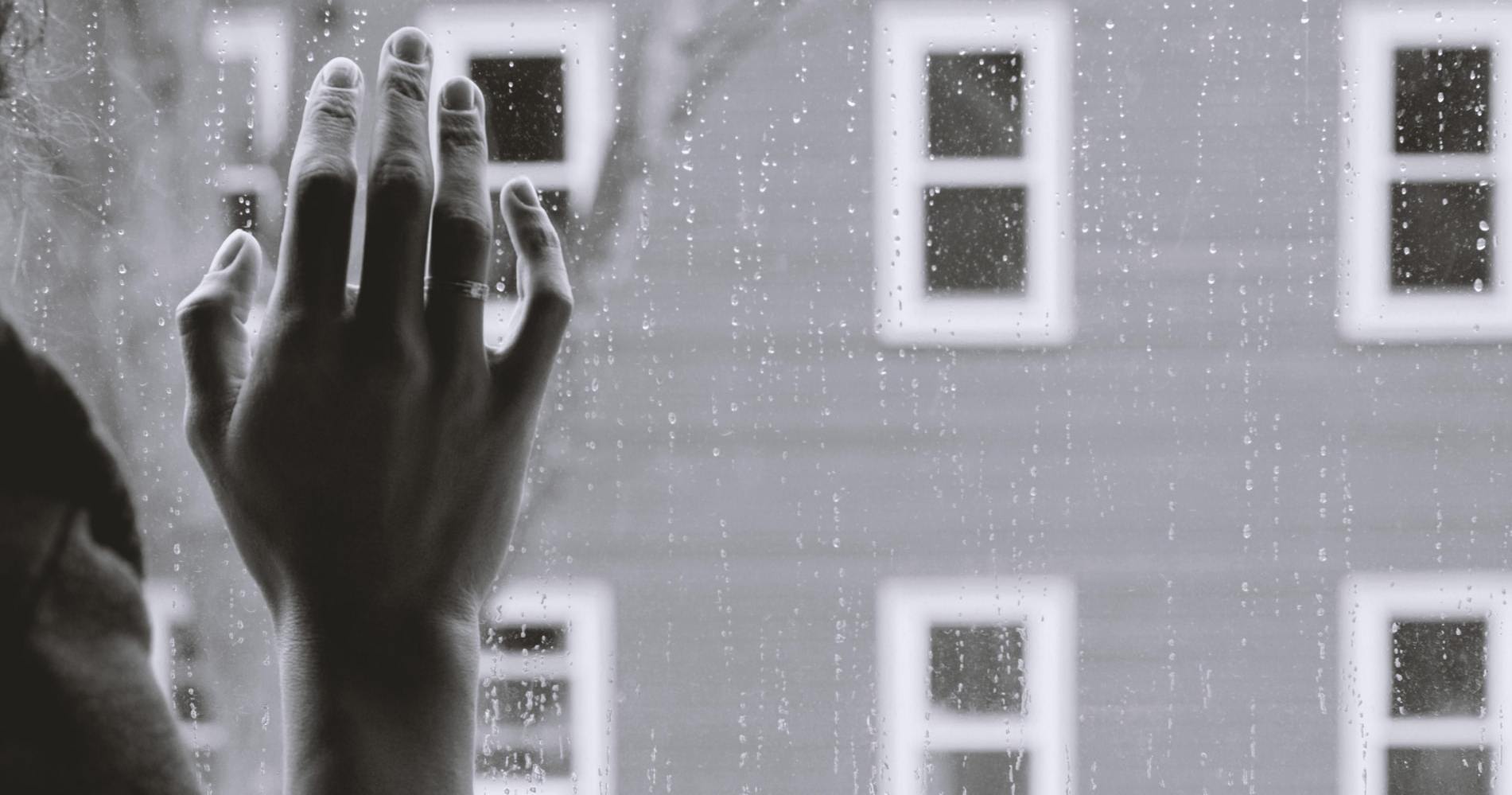 hand on glass window