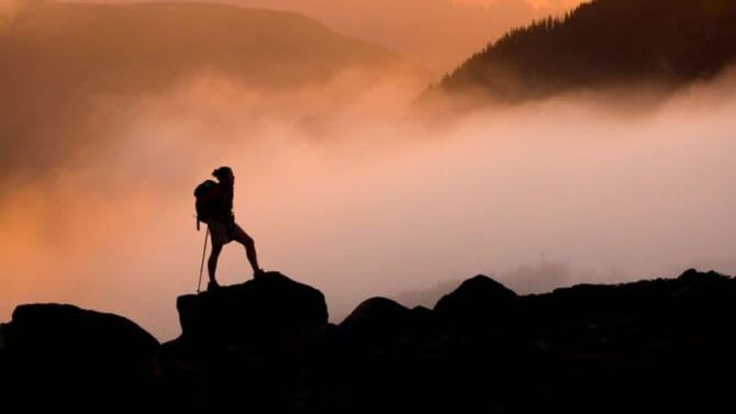 Adventure-hiking-among-clouds-768x511
