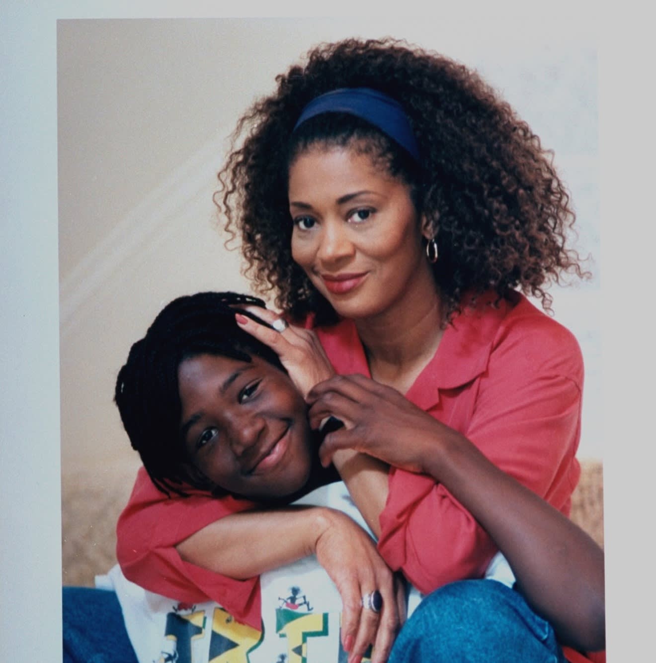 Author Terry McMillan posing w. arms around son Solomon at home. (Photo by John Storey/Getty Images)