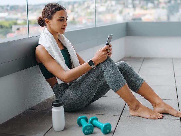 female-looking-at-phone-after-workout-1200-628-facebook-732x549
