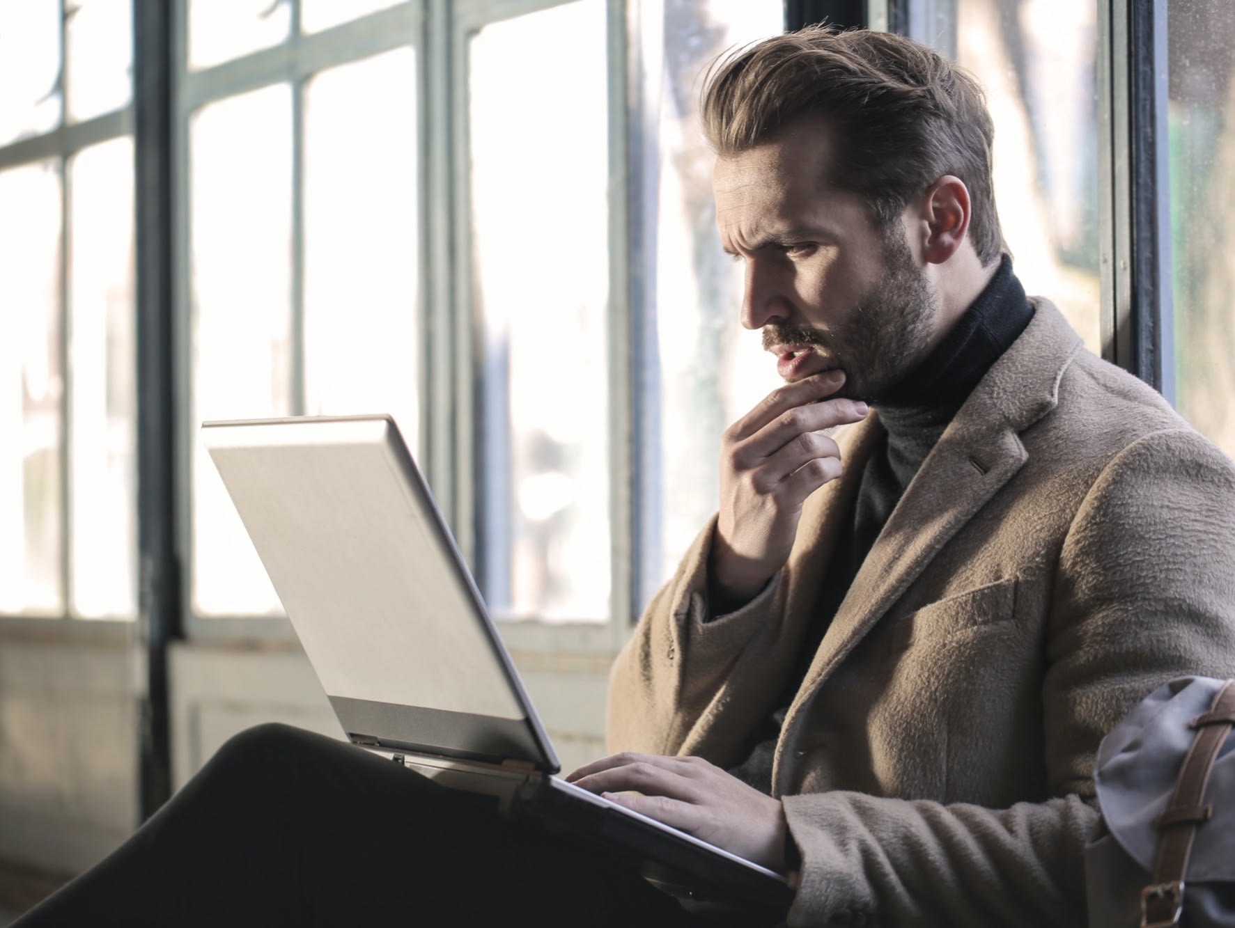 man sitting with laptop