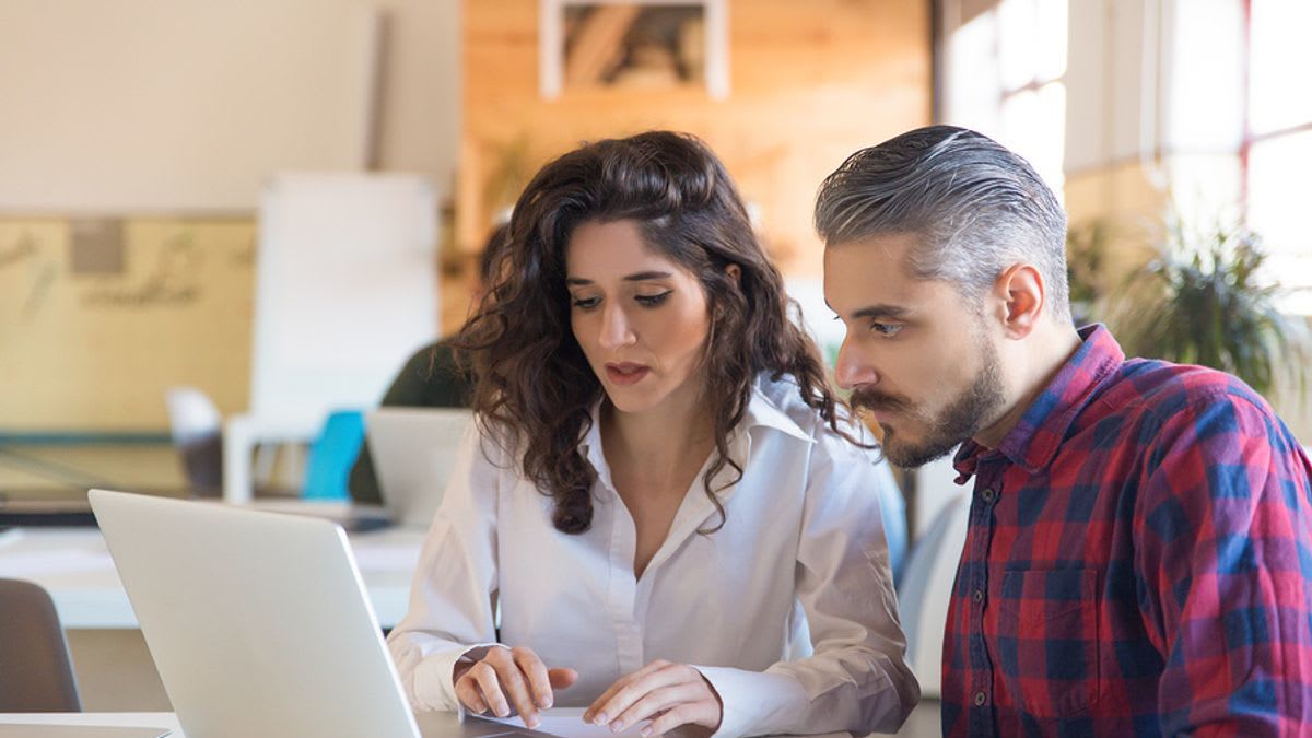 woman-stands-out-at-work-by-helping-her-coworkers