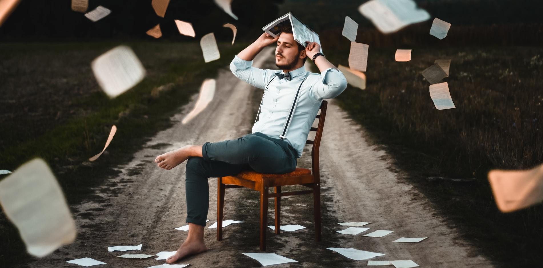 man with a book on his head