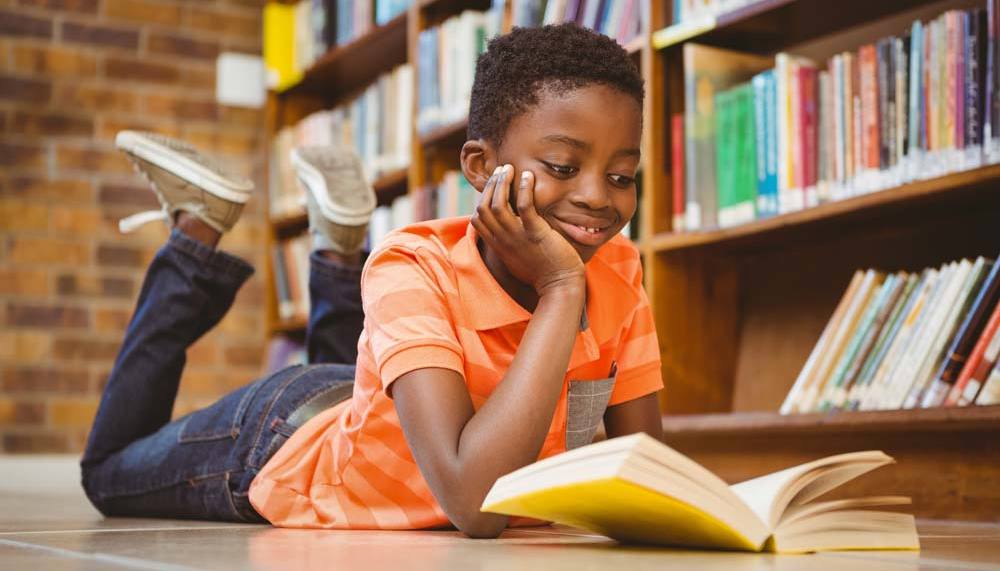 Young-Boy-Reading-in-the-Library