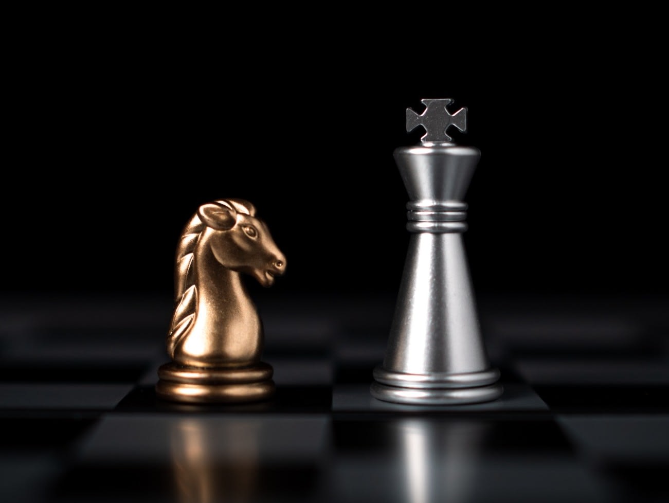 vecteezy_gold-and-silver-chess-pieces-in-chess-board-game-for_32486020