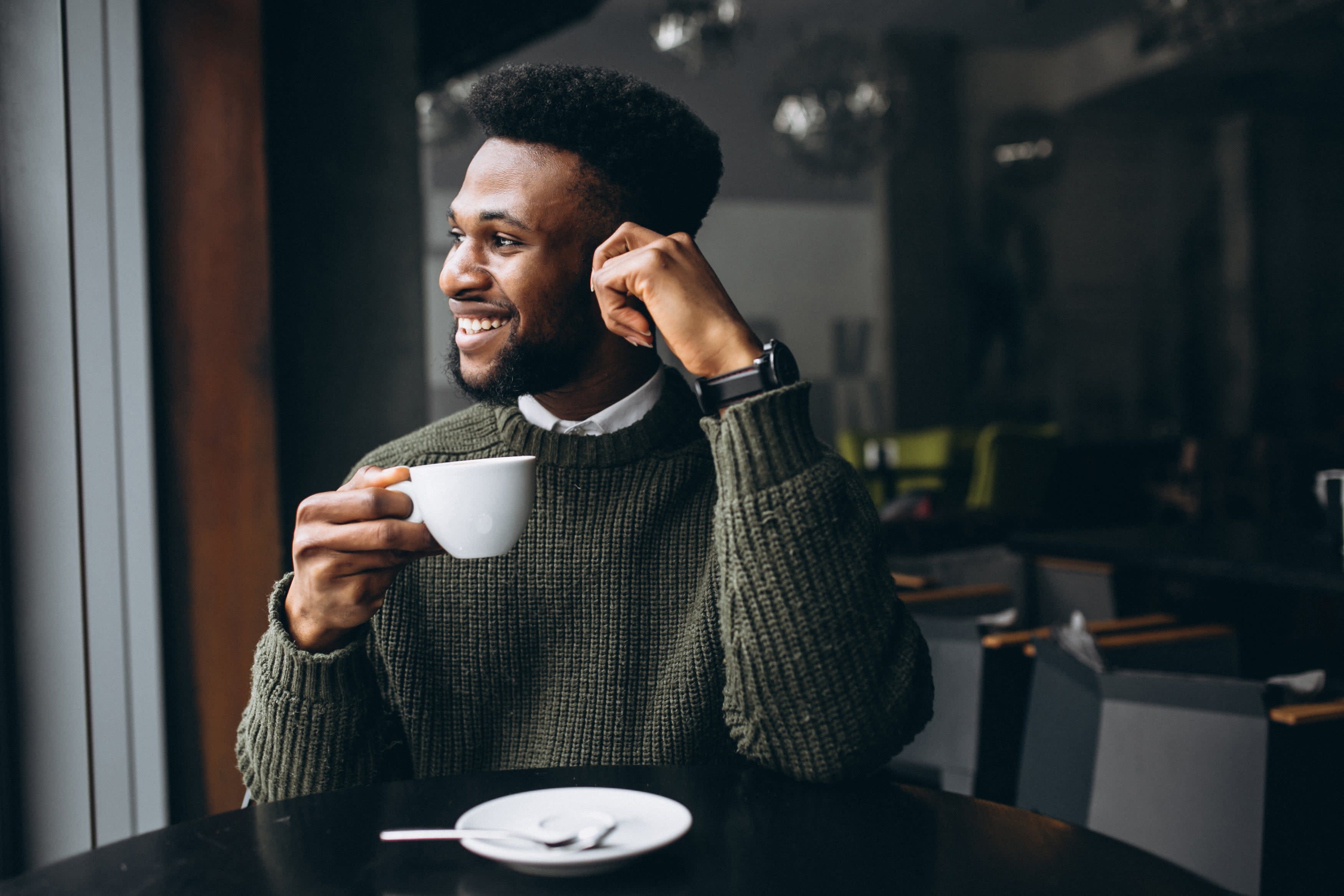 african-american-man-drinking-coffee-cafe