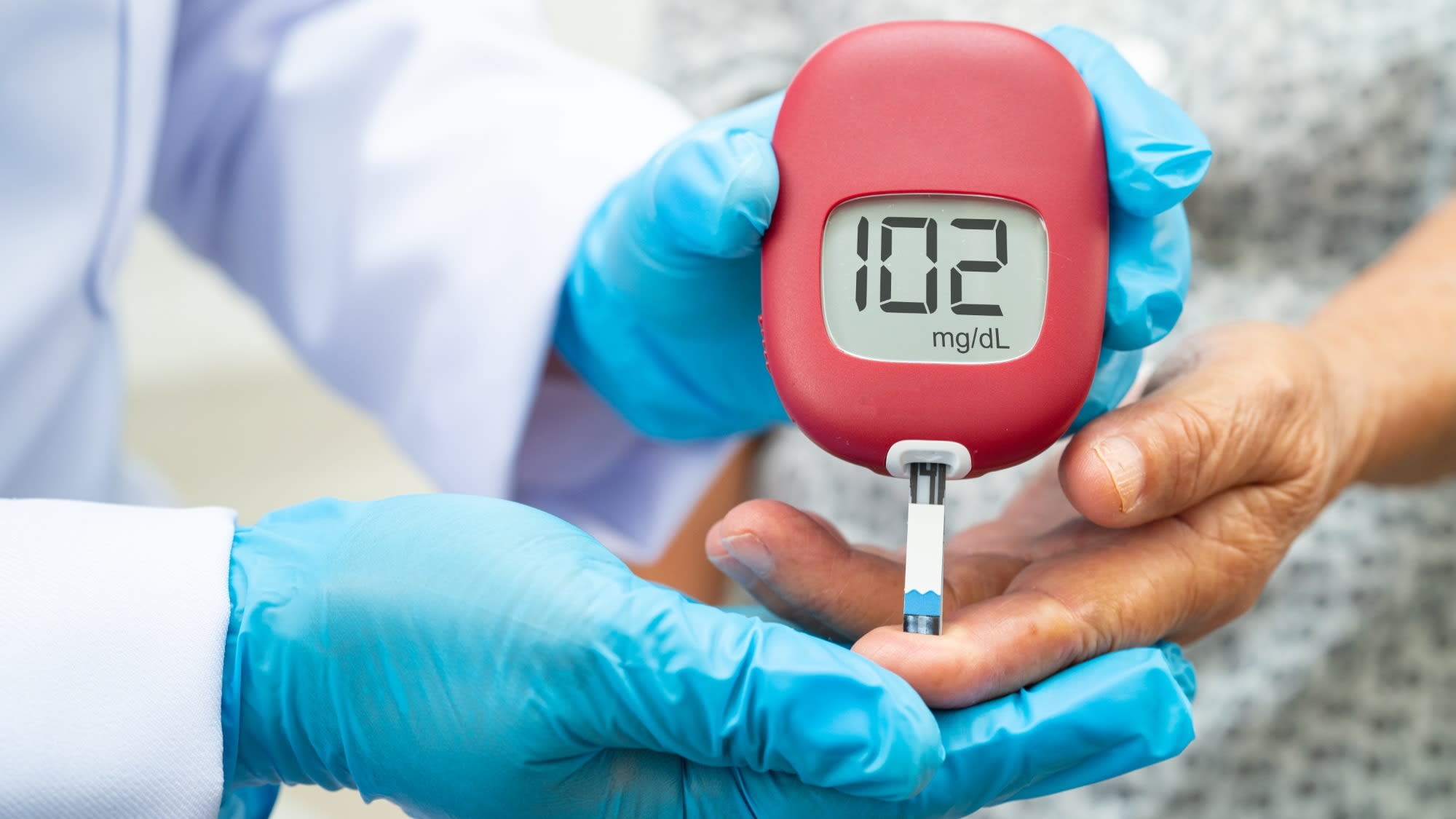doctor-check-diabetes-from-finger-blood-sugar-leve-2025-02-25-07-42-41-utc