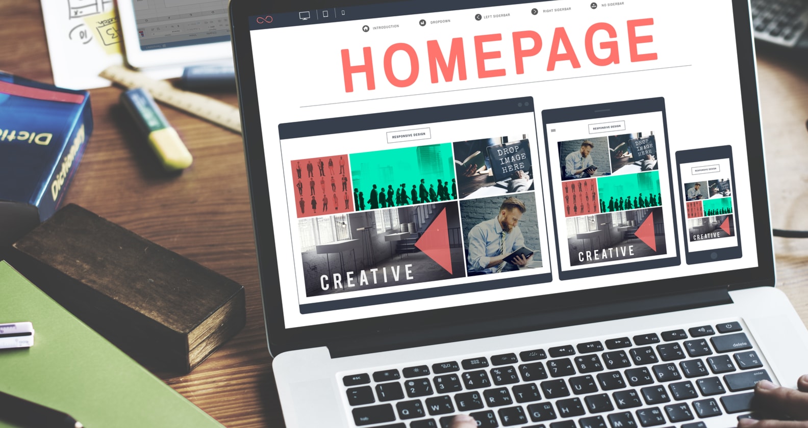 A computer screen containing graphics that show the design of a website homepage