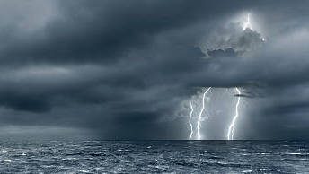 intense-thunderstorm-over-ocean-with-lightning